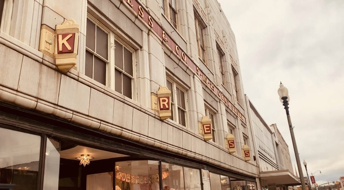 The 1935 Kress building on Noble Street, Anniston, with its lit vertical KRESS sign