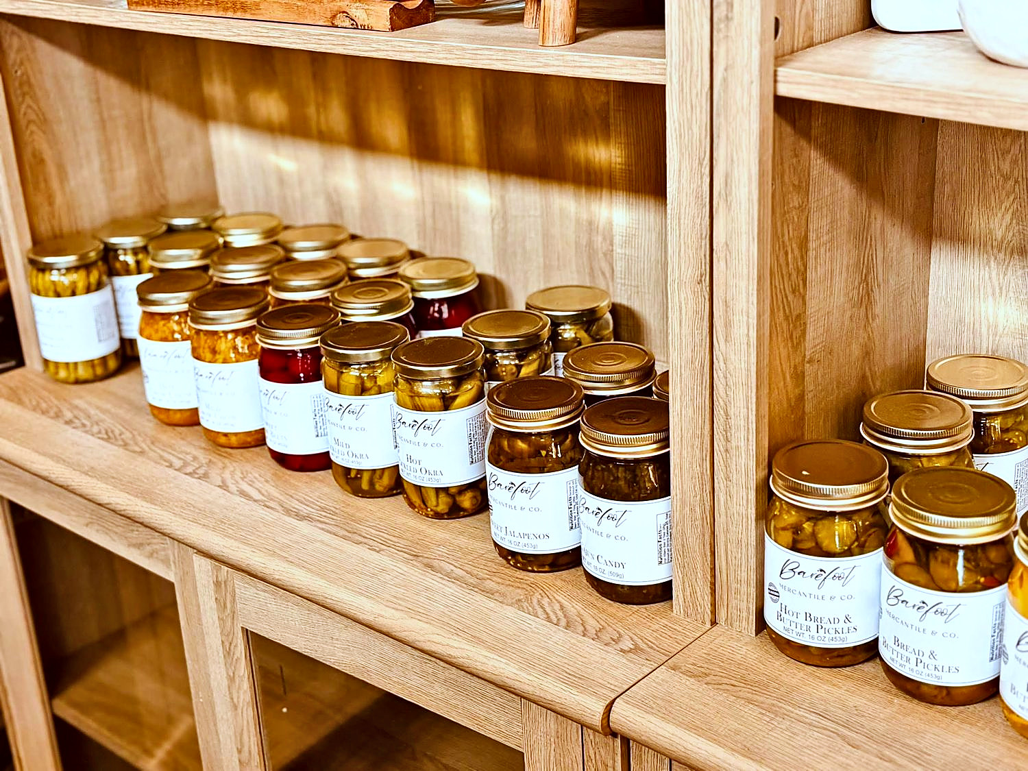 Jars of preserves on wooden shelves