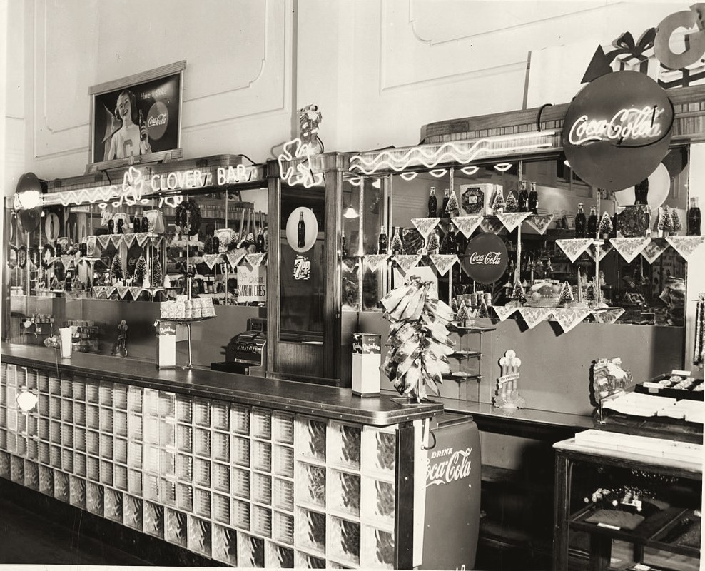 The old Kress checkout counter, with neon signs, Coca-Cola displays and Christmas trees on the shelves